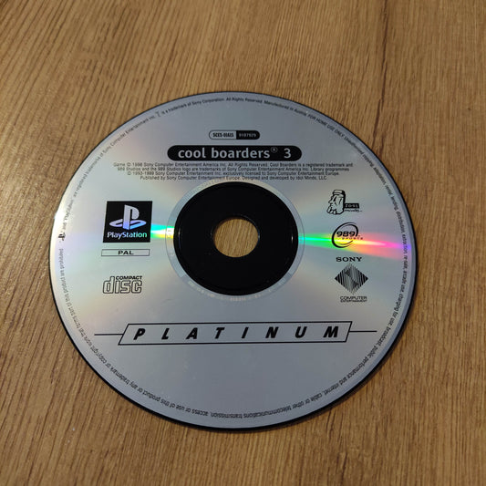 PlayStation Platinum disc on a wooden surface
